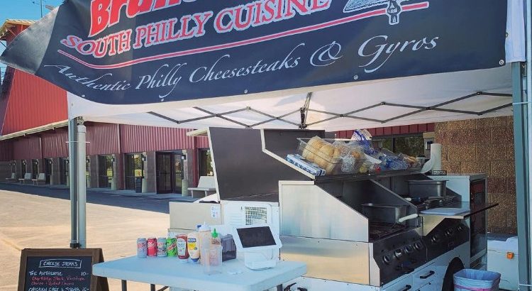 Bruneau's Food Cart (5-Star Reviews) stands ready to serve people just before an event starts